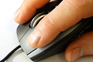 hand on computer mouse